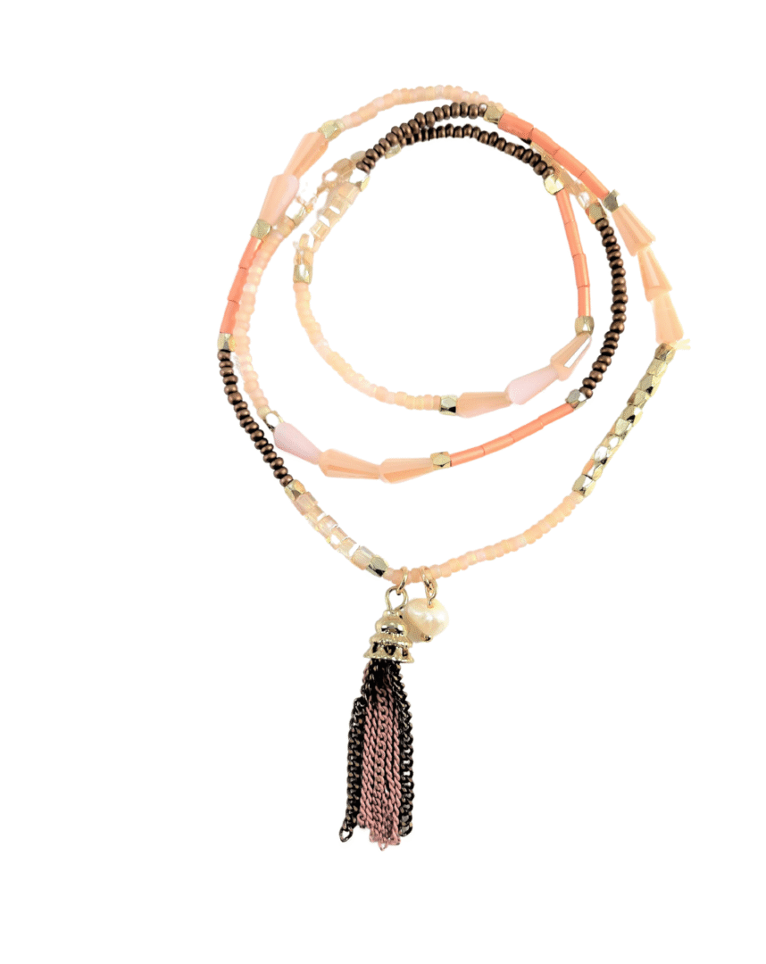 Multi-strand beaded necklace with a tassel pendant in pink and black.