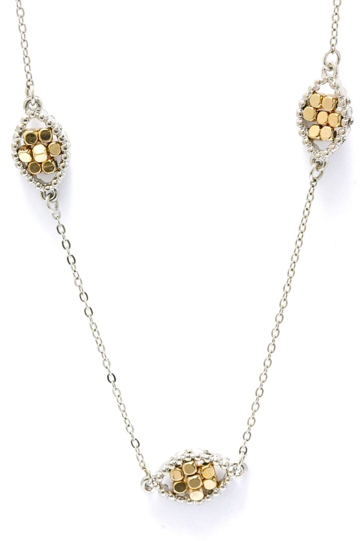 Gold and silver chain necklace with two unique beaded ends.