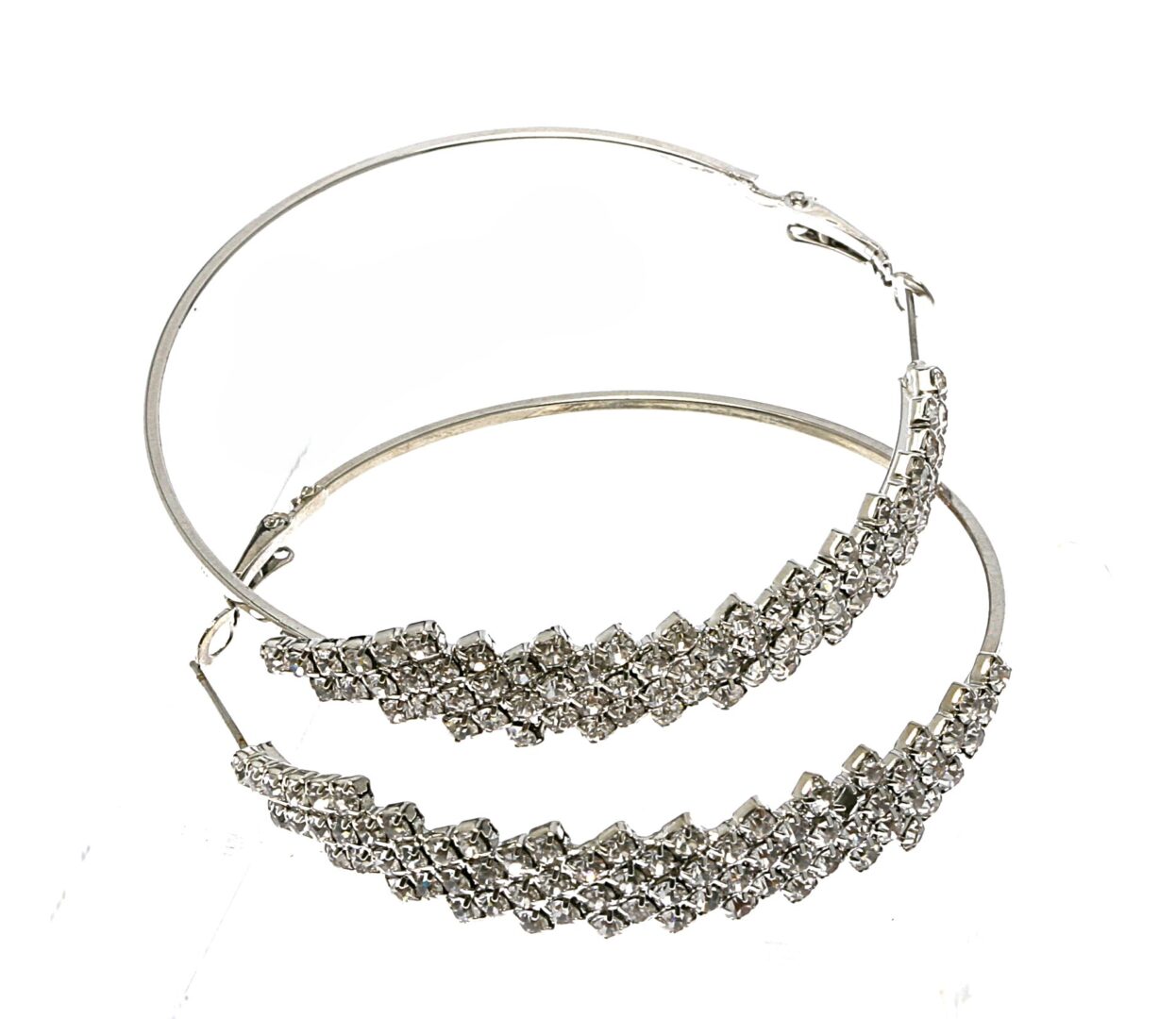 Silver hoop earrings with intricate bead detailing.