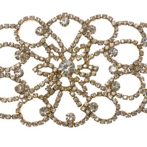 Intricate vintage brooch adorned with sparkling rhinestones.