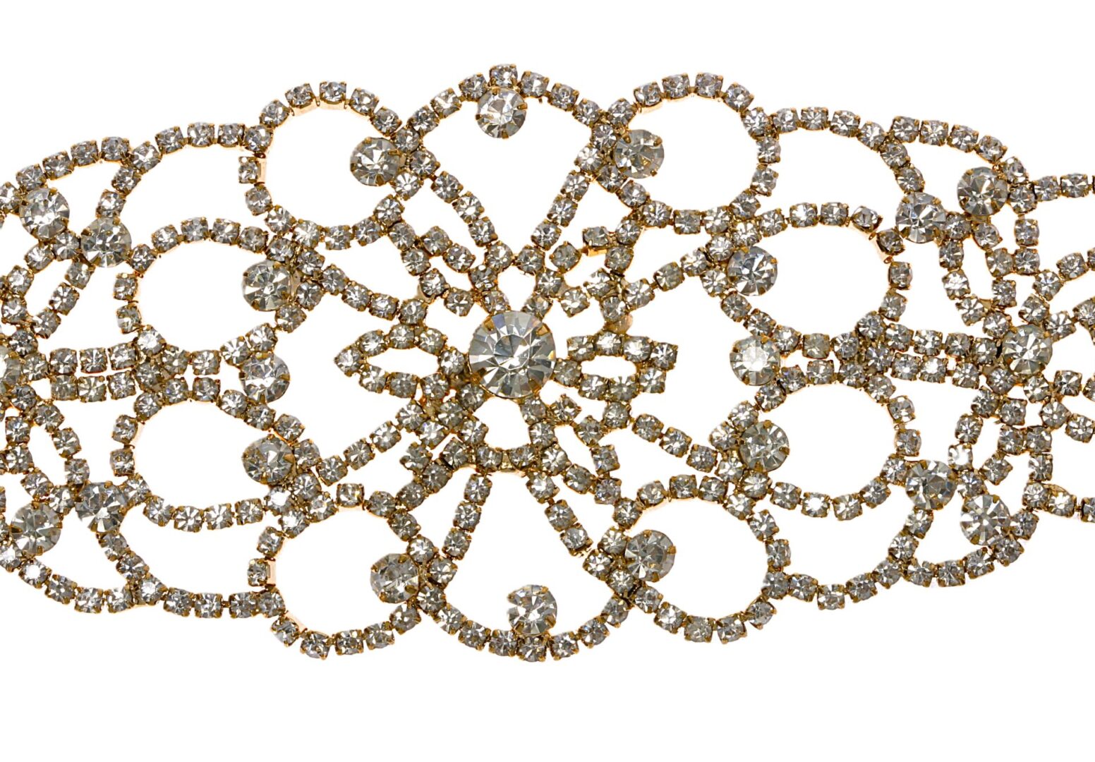 Intricate vintage brooch adorned with sparkling rhinestones.
