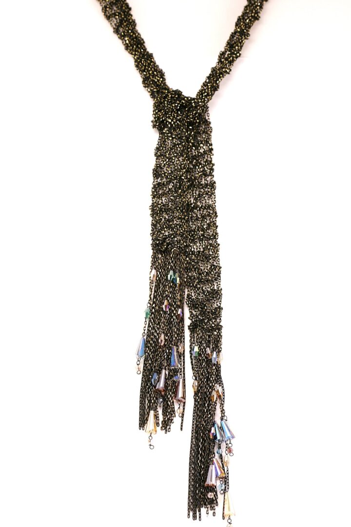 A long, braided rope or cord with tassels at the end.