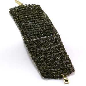 Metal scrubber pad for cleaning dishes and surfaces.