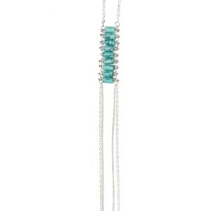 Close-up of a silver and turquoise beaded necklace pendant.