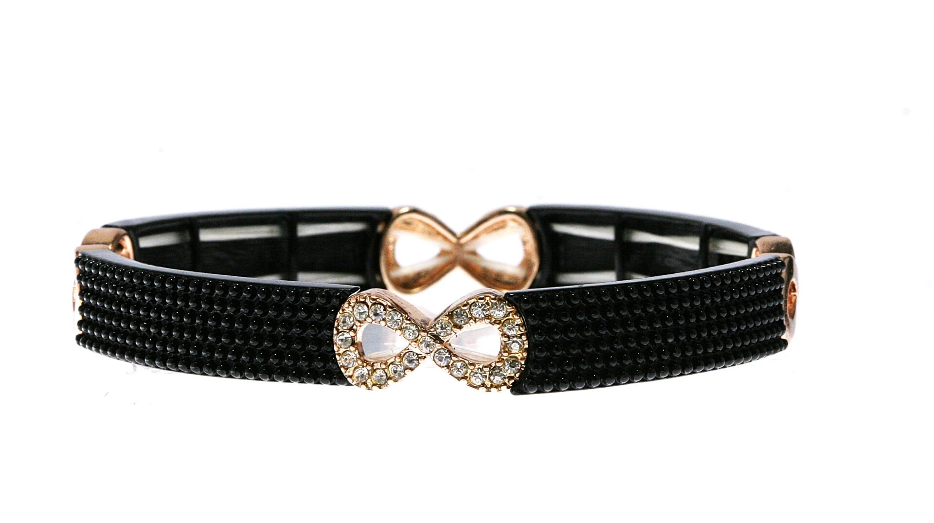 Two black bracelets with infinity symbols, one gold and one silver with a gem.