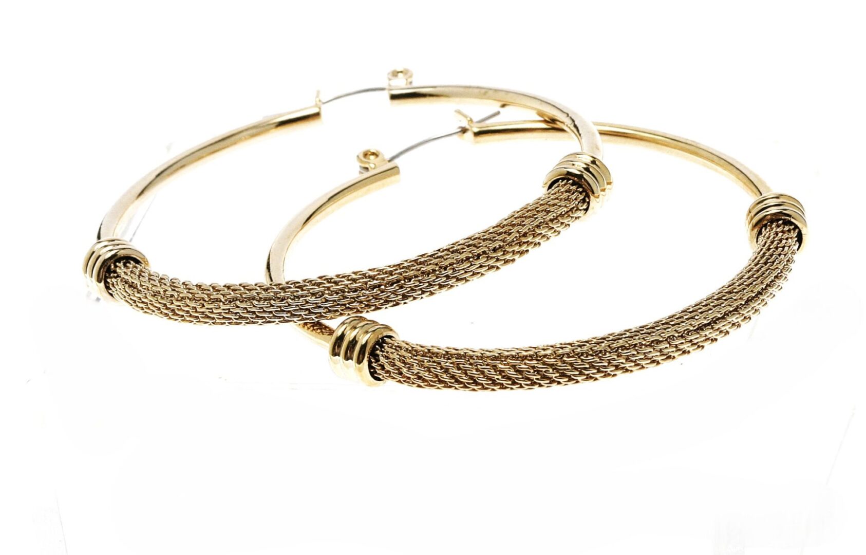 Elegant gold hoop earrings with intricate woven design.