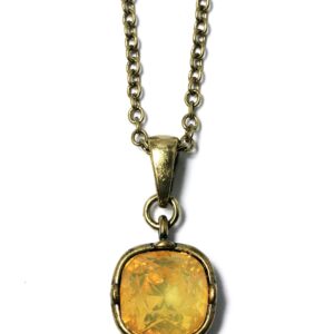 Gold pendant necklace with a yellow gemstone.