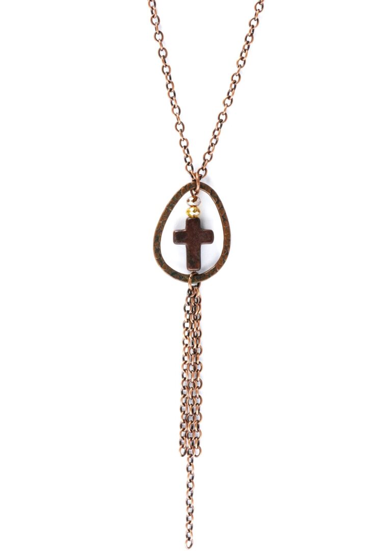 Elegant rose gold necklace with a cross pendant and tassel chain.