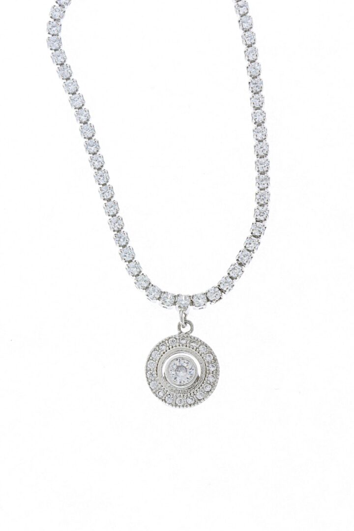 Elegant silver necklace with a circular pendant featuring embedded crystals.