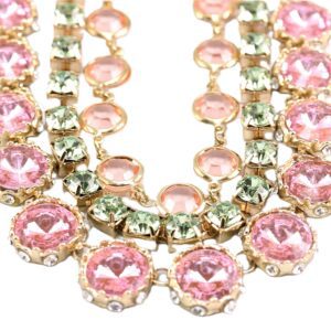 Elegant necklace with pink and clear gemstones in a gold setting.