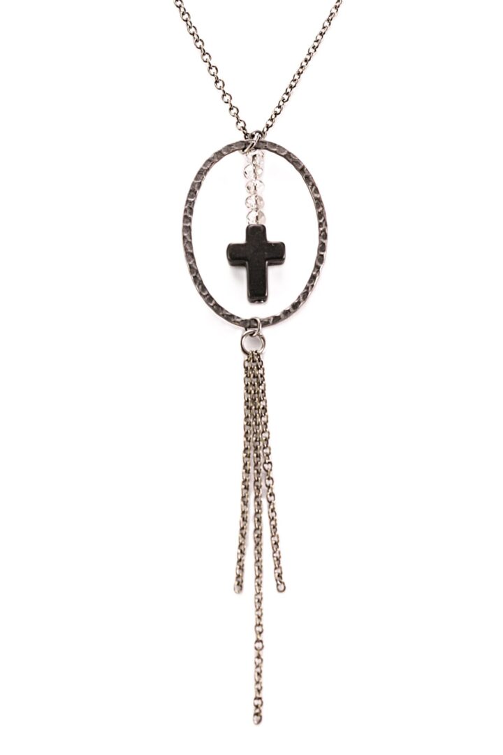 Silver necklace with a black cross pendant and dangling chains.