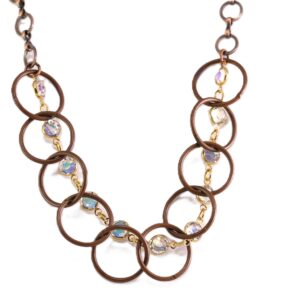 Elegant necklace with bronze rings and sparkling crystals.