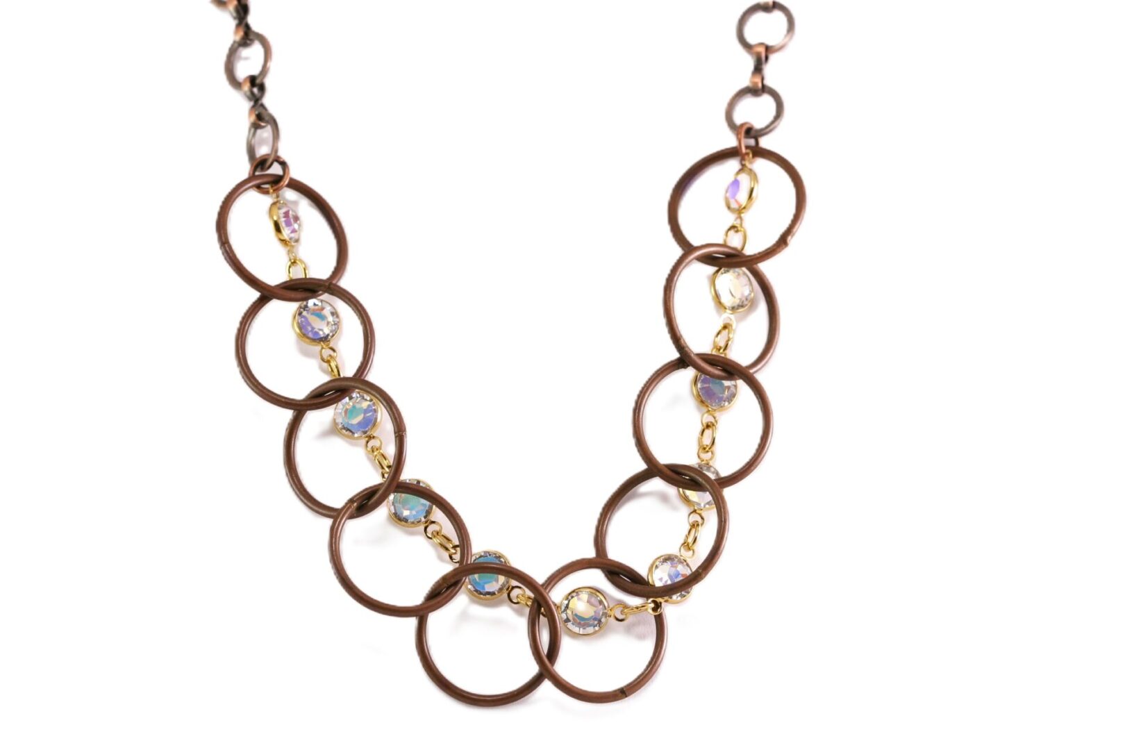 Elegant necklace with bronze rings and sparkling crystals.