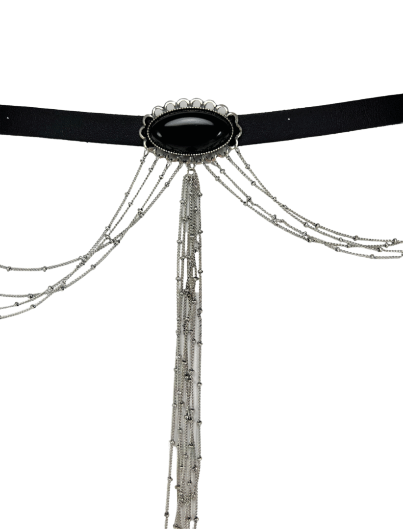 A tall amusement ride with suspended seats and chains.