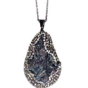 Teardrop pendant with a dark, iridescent stone surrounded by small crystals on a chain.