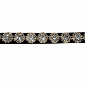 A close-up of a sparkly diamond bracelet with a silver band.