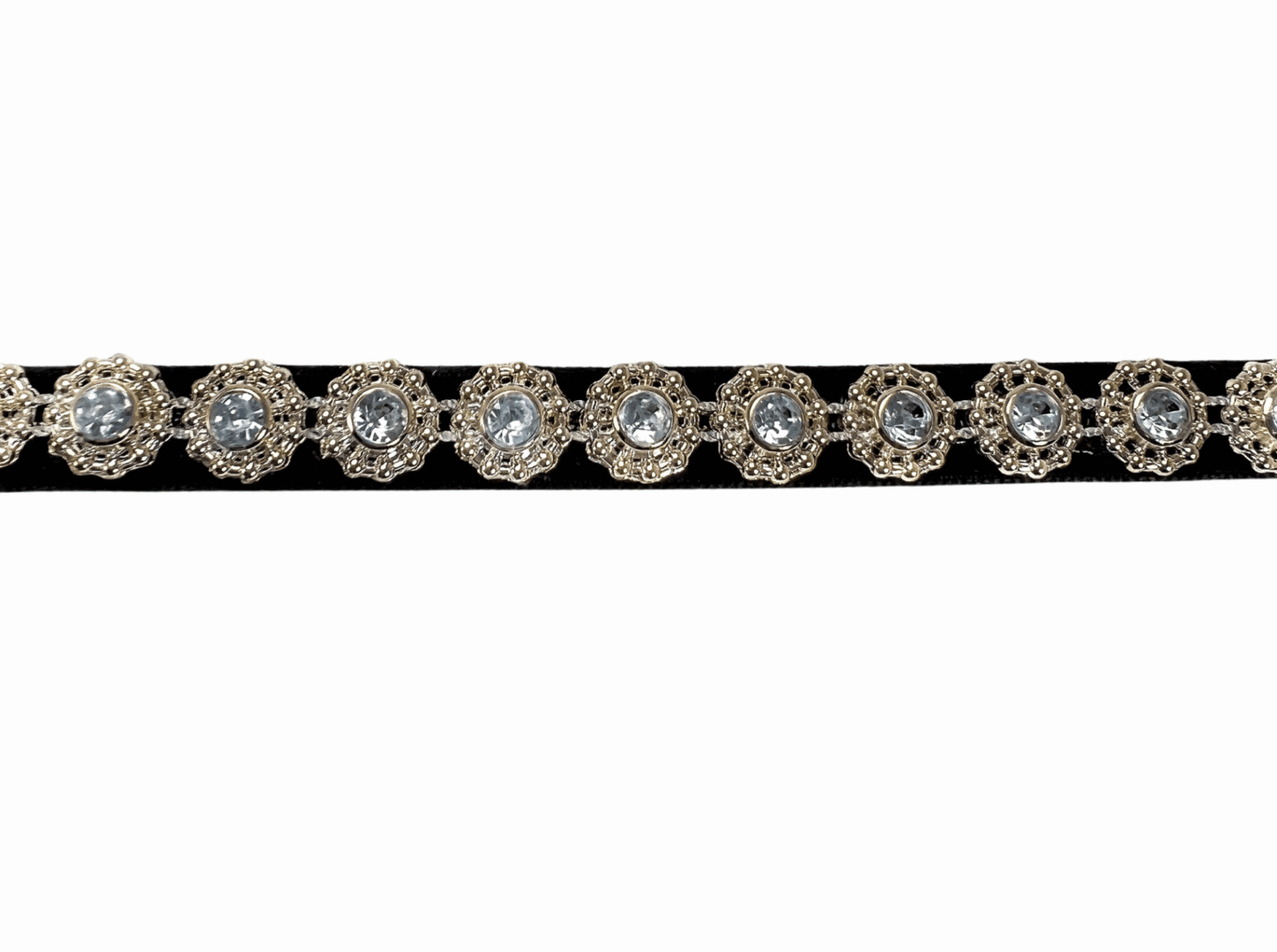 A close-up of a sparkly diamond bracelet with a silver band.