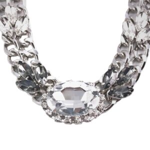 Elegant silver necklace with a large central gemstone.