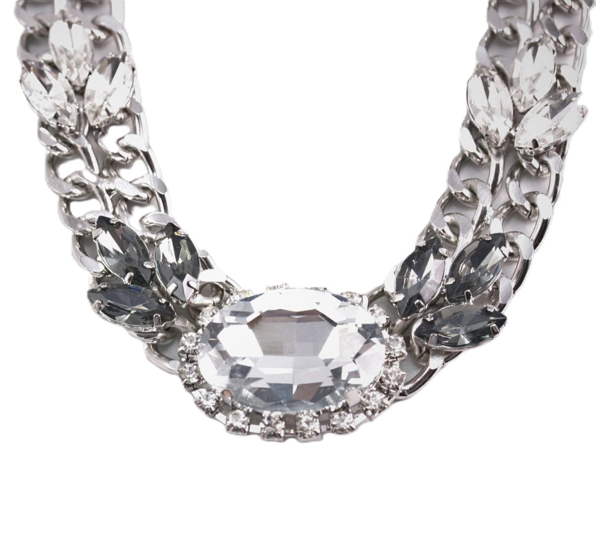 Elegant silver necklace with a large central gemstone.