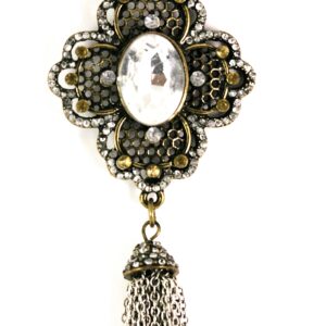 Vintage brooch with a cameo and dangling tassel.