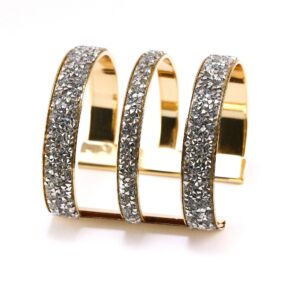 Elegant triple-band gold ring with sparkling diamonds.