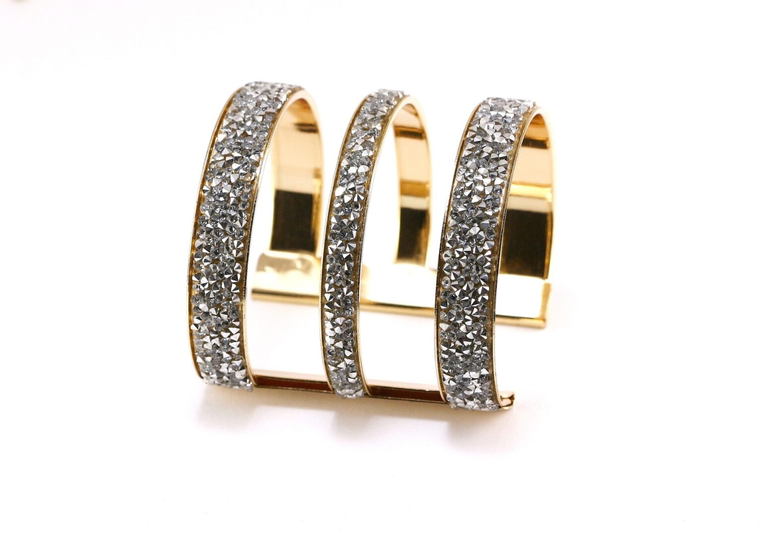 Elegant triple-band gold ring with sparkling diamonds.