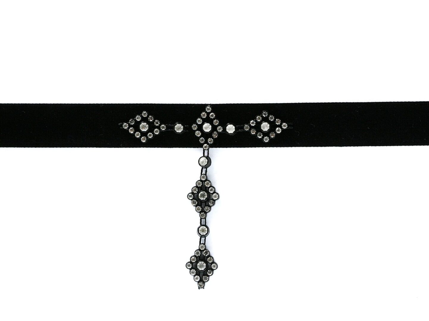 Black velvet choker with ornate silver and gem embellishments.