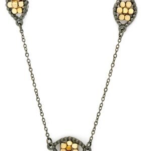 Antique-style necklace with floral motifs in gold and silver tones.